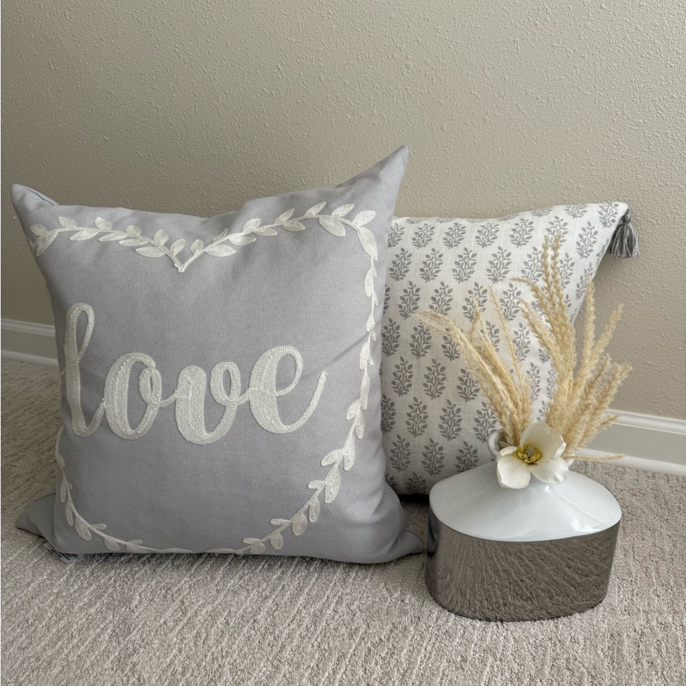Gray and White Decorative Pillow Set With Silver and White Vase